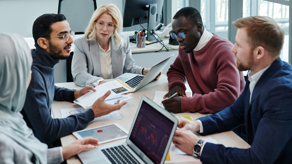 The board of directors of a small business discusses implementation of a new apprenticeship tracking system.