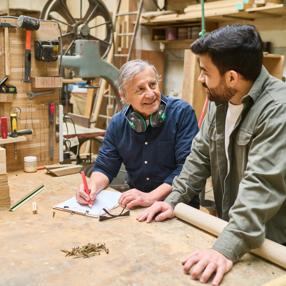 College apprentice working alongside an employer mentor